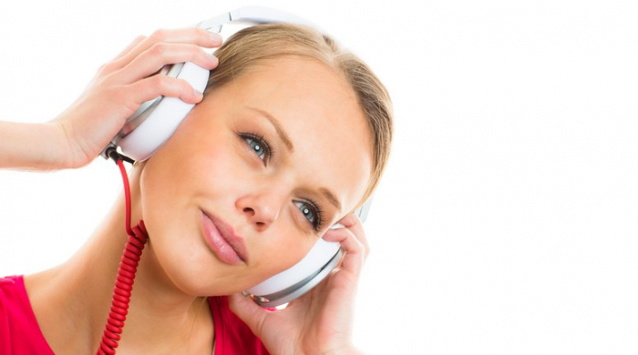 Girl on headphones alamy