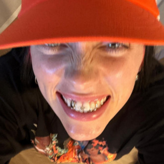 Billie Eilish stuns fans by showing off diamond teeth grills: ‘Wtf has she done?!’